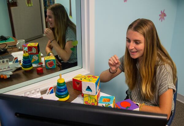 Sarah Hudgins interacts with a client during a teletherapy session the Auditory-Verbal Center in Atlanta.  PHIL SKINNER FOR THE ATLANTA JOURNAL-CONSTITUTION.