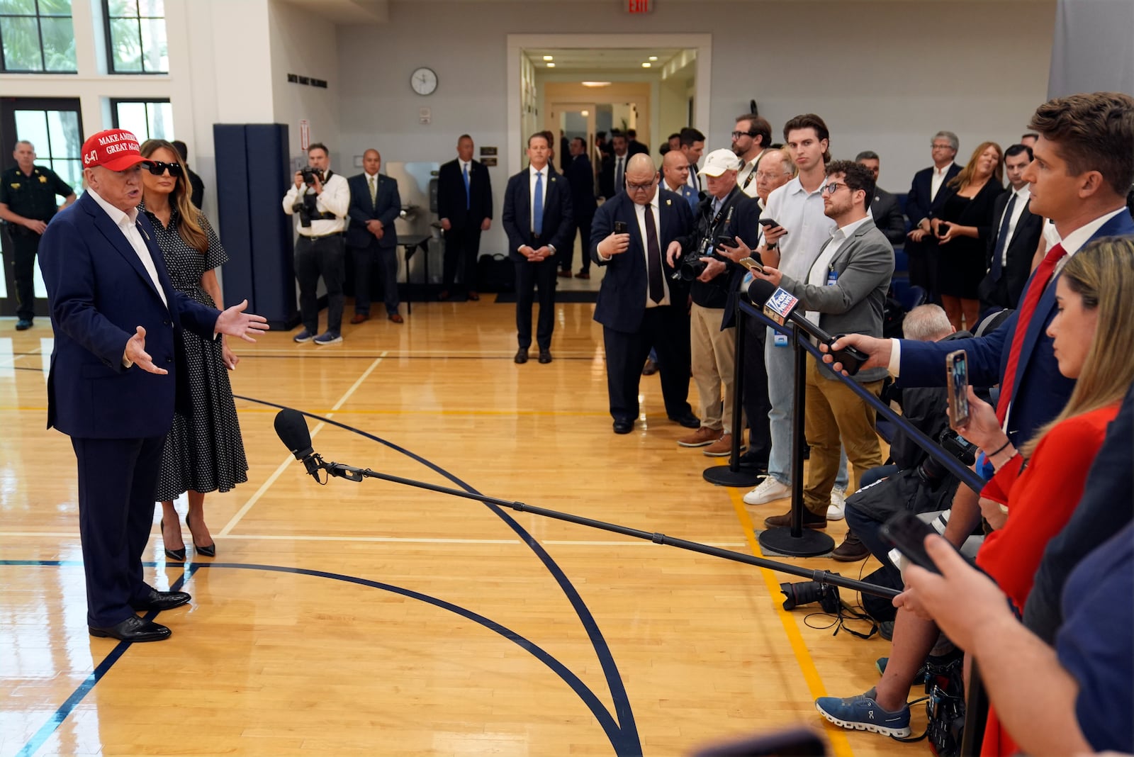 Republican presidential nominee former President Donald Trump speaks as former first lady Melania Trump listens after they voted on Election Day at the Morton and Barbara Mandel Recreation Center, Tuesday, Nov. 5, 2024, in Palm Beach, Fla. (AP Photo/Evan Vucci)