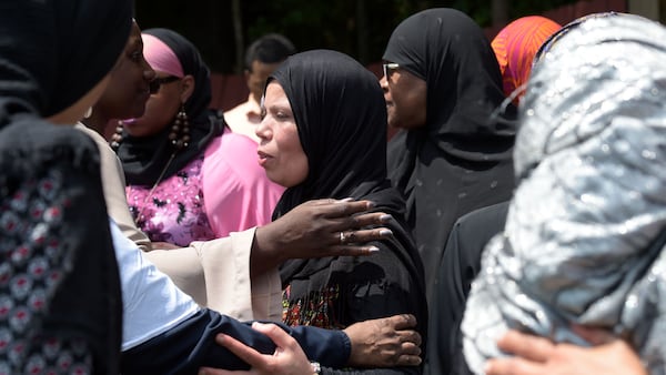 8/23/18 - Atlanta - People console Hakima Ramzi, the mother of Abdul-ghani Wahhaj, at the child's burial on Thursday, August 23. Jenna Eason / Jenna.Eason@coxinc.com