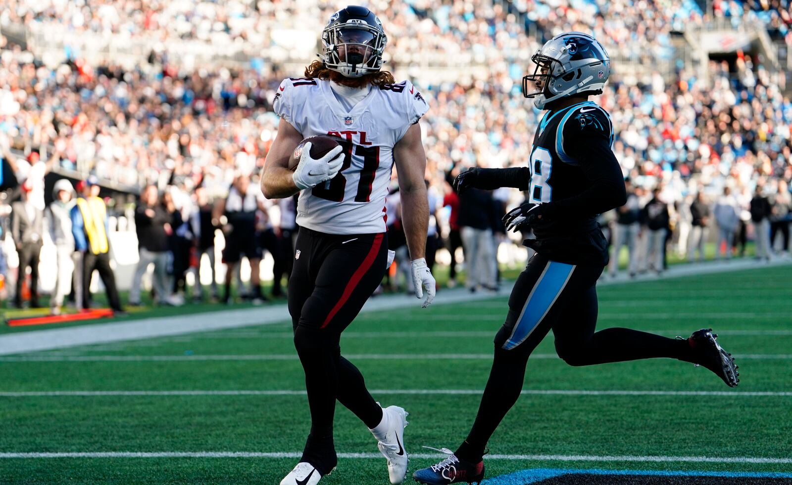 Falcons tight end Hayden Hurst scores on a pass from Matt Ryan during the second half of Sunday's game against the Panthers in Charlotte.