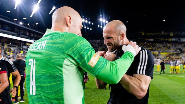 Atlanta United interim manager Rob Valentino celebrates with goalkeeper Brad Guzan (1) 3-2 win against Columbus Crew Saturday, Aug. 7, 2021, at Lower.com Field in Columbus, Ohio. (Jacob Gonzalez/Atlanta United)