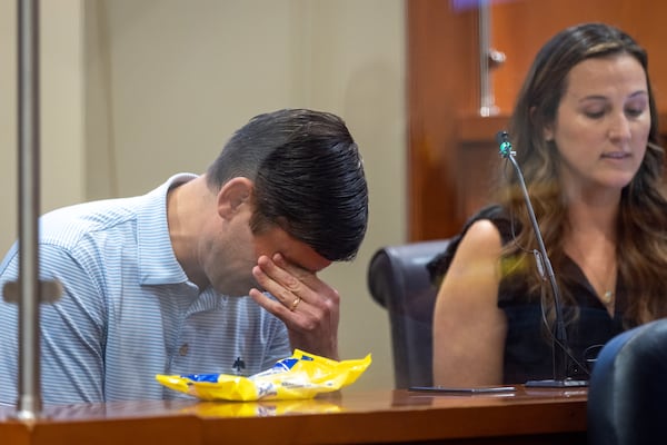 Eric and Stephanie Cronmiller give a victim statement at the DeKalb County Courthouse on Friday. The Cronmillers’ 4-month-old boy died while in Amanda Hickey's care. Arvin Temkar/arvin.temkar@ajc.com