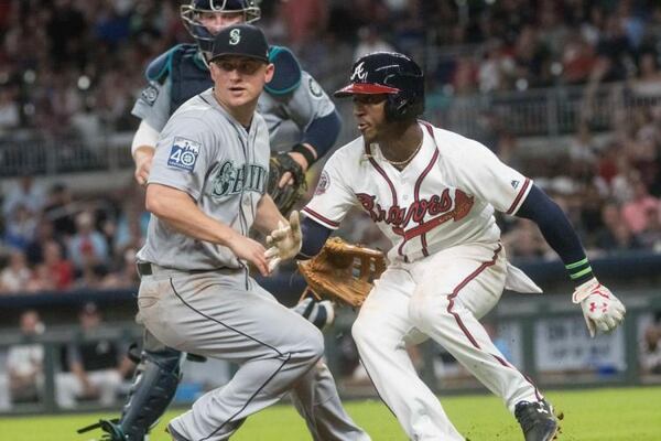  Ozzie Albies, right, supplanted veteran Brandon Phillips at second base the day that Albies arrived from Triple-A and has been the every-day starter since. (AP photo)