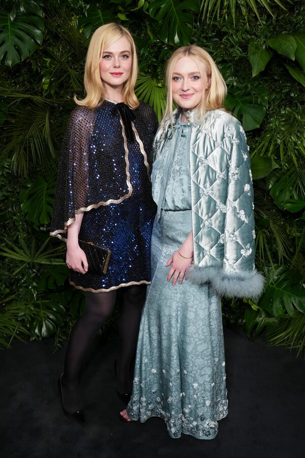 Elle Fanning, left, and Dakota Fanning arrive at Chanel's 16th Annual Pre-Oscar Awards Dinner on Saturday, March 1, 2025, at The Beverly Hills Hotel in Beverly Hills, Calif. (Photo by Jordan Strauss/Invision/AP)