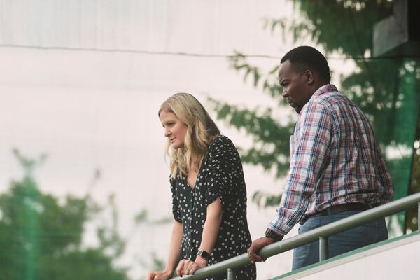 Zimbabwe Sports Minister Kirsty Coventry, left, and Zimbabwe Cricket Director Hamilton Masakadza follow the test cricket match between Zimbabwe and Sri Lanka at Harare Sports Club, in Harare, Thursday, Jan. 30, 2020. (AP Photo/Tsvangirayi Mukwazhi)