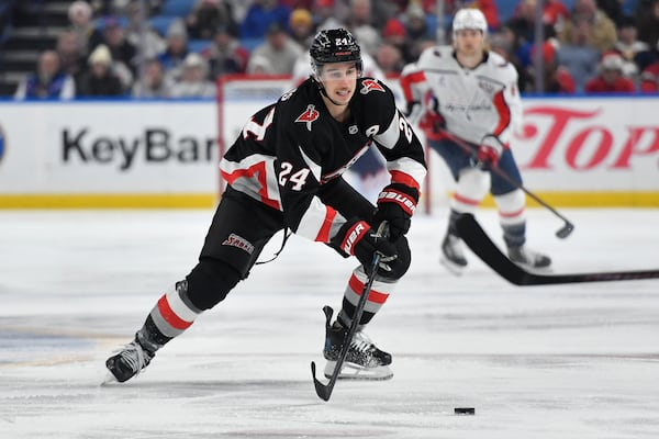 FILE - Buffalo Sabres center Dylan Cozens (24) skates with the puck during the first period of an NHL hockey game against the Washington Capitals in Buffalo, N.Y., Monday, Jan. 6, 2025. (AP Photo/Adrian Kraus, File)