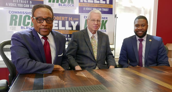 Rick Blalock, attorney David Betts and Robert Kelly after a Friday press conference