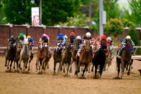 Horses round the fourth turn during the 148th running of the Kentucky Derby horse race at Churchill Downs Saturday, May 7, 2022, in Louisville, Ky. (AP Photo/Brynn Anderson)