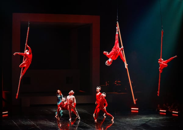 Artists move across the "Echo" stage on poles. Photo: Jean-François Savaria