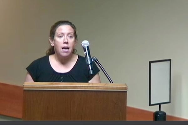 Jennifer Jensen, founder of the local muckraking blog the Johns Creek Post, goes on the offense at the City Council meeting on Monday, Sept. 24, 2018.