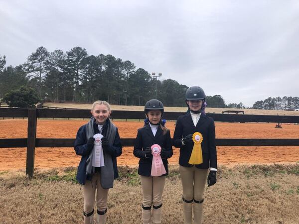 On Saturday, January 30, the Piedmont Academy Equestrian team competed in an Interscholastic Equestrian Association (IEA) horse show at Wellspring Farm located in Monroe. The Middle School Hunt Seat Team results are as follows:  Lyleigh Thompson took 4th place in the Beginner Walk/Trot Equitation on the Flat class, Madalynn Bryant finished 5th place in the Beginner Walk/Trot Equitation of the Flat class and Isabel White took 3rd place in the Beginner Walk/Trot/Canter Equitation on the Flat class.
Pictured:  Lyleigh Thompson, Madalynn Bryant and Isabel White