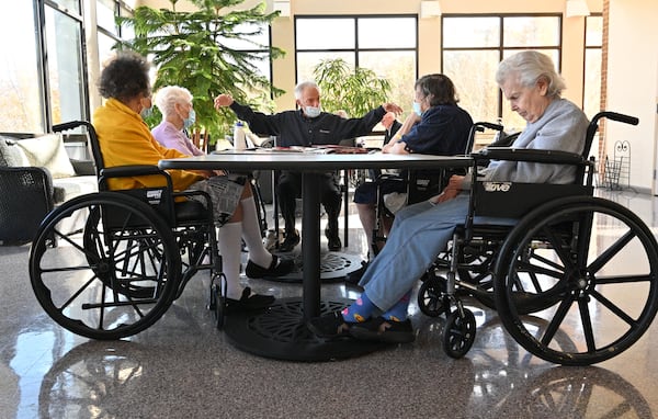 Dr. Mike Levine, a volunteer, talks to senior residents during their current event session at William Breman Jewish Home. The staff at Breman is now either fully vaccinated (97%) or have an exemption (3%). (Hyosub Shin / Hyosub.Shin@ajc.com)