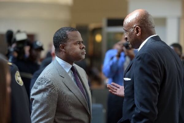 Miguel Southwell (right) talks with Atlanta Mayor Kasim Reed in friendlier times. Kent D. Johnson, kdjohnson@ajc.com