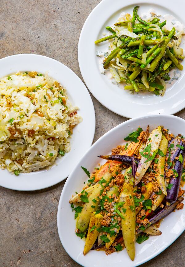 Among the vegetable dishes at Adele's are (clockwise from left)  cauliflower salad, roasted asparagus with lemon yogurt dressing, and charred heirloom carrots with spicy granola. Ryan Fleisher for The Atlanta Journal-Constitution