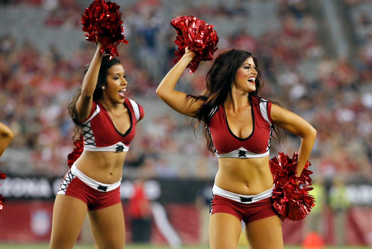 NFL cheerleaders perform at preseason games