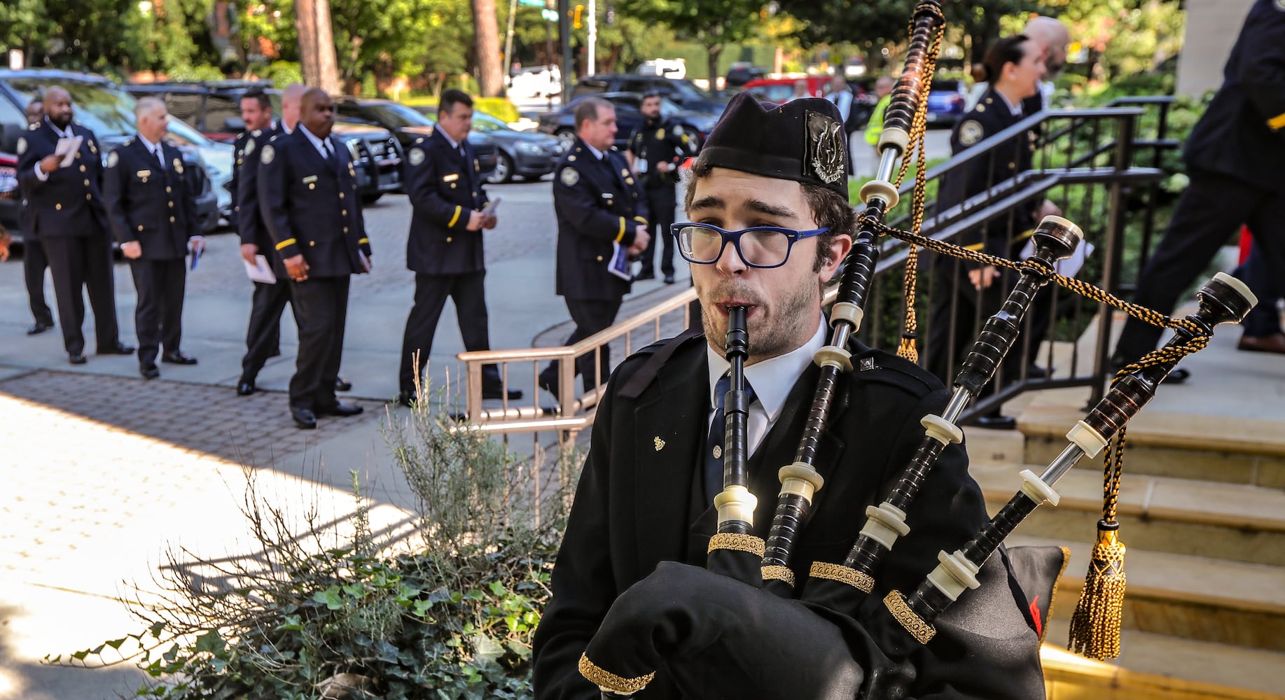 September 11, 2023 Atlanta: Sam Wiley, a sergeant with the Atlanta Pipe Band played his bagpipe as police entered the Cathedral of Christ the King. Atlanta police and firefighters were in attendance on Monday, September 11, 2023 at the Cathedral of Christ the King, 2699 Peachtree Road, NE in Buckhead in observance of the Blue Mass. The annual Mass honors public safety officials and first responders. City of Atlanta Mayor, Andre Dickens, along with police, fire officials and honor guards participated in the solemn Mass led by Rector, Monsignor Francis G. McNamee. Wreaths were posted in front of the of the church, honoring those who lost their lives on Sept. 11, 2001. The Blue Mass tradition began in 1934, when a priest from the Archdiocese of Baltimore, Father Thomas Dade formed the Catholic Police and Firemen’s Society. (John Spink / John.Spink@ajc.com)

