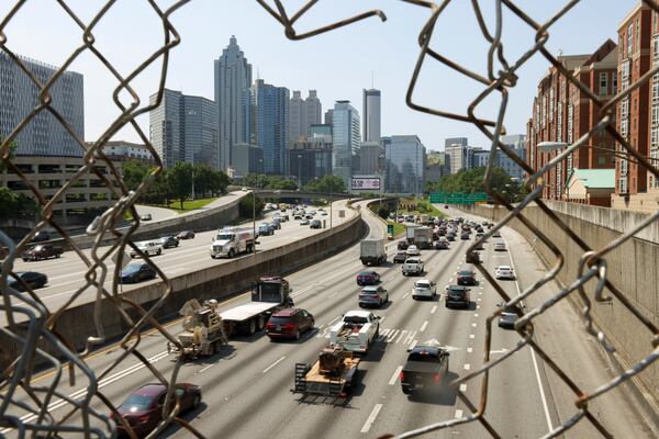 Automobiles travel south on the I-85 / I-75 connector as seen from the North Avenue bridge, Thursday, May 25, 2023, in Atlanta. (Jason Getz / Jason.Getz@ajc.com)