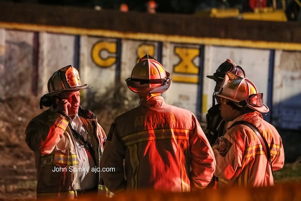 Atlanta firefighters responded Thursday morning after a train derailed and crashed into a house in northwest Atlanta. JOHN SPINK / JSPINK@AJC.COM