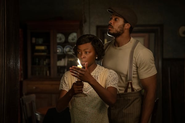 This image released by Netflix shows Danielle Deadwyler, left, and Ray Fisher in a scene from "The Piano Lesson." (David Lee/Netflix via AP)