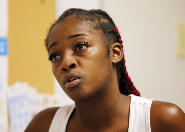 Dennishia Davis talks about her situation and why she came to the co-op for help. BOB ANDRES /BANDRES@AJC.COM