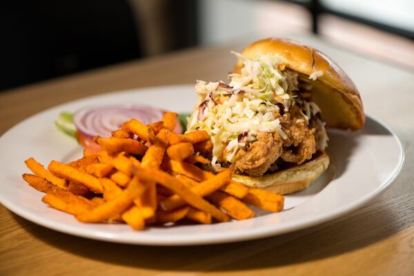  Fried Chicken Sandwich with buttermilk fried chicken, Carolina gold sauce, lettuce, tomato, coleslaw, brioche bun. Photo credit- Mia Yakel.