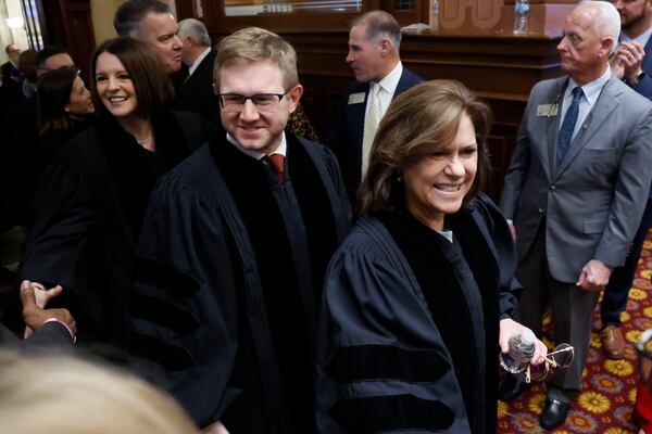 Georgia Supreme Court Judges greet lawmakers before the annual State of the Judiciary address in January. Their retirement age is 65, which is the proposed new standard for the Georgia Superior Court.