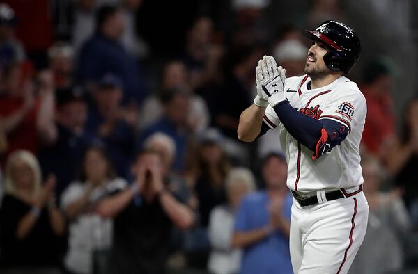 Atlanta Braves' Adam Duvall celebrates after hitting a home run against the Washington Nationals during the eighth inning of a baseball game Thursday, Sept. 9, 2021, in Atlanta. (AP Photo/Ben Margot)