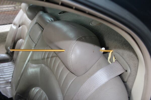 This image shows the assumed trajectory of the bullet that passed through the back seat of the Pontiac Bonneville and into the car's trunk. (Atlanta Police Department)