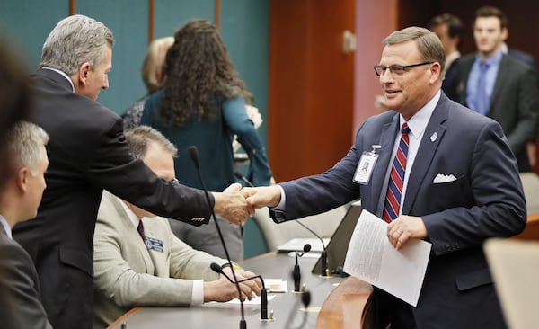 Mike Griffin (right), a lobbyist for the Georgia Baptist Mission Board, is concerned about language in Senate Bill 88. (Bob Andres/The Atlanta Journal-Constitution)