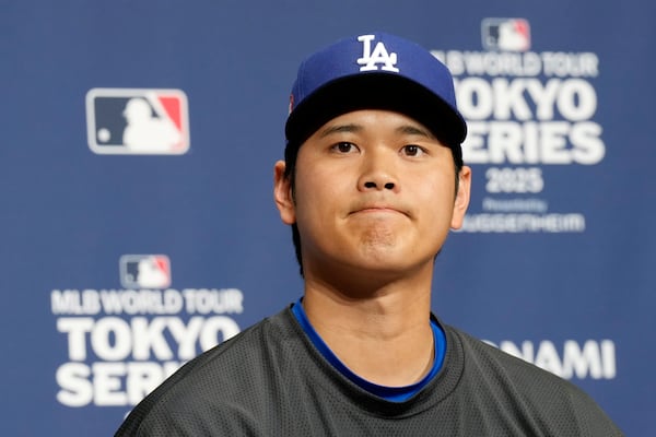 Los Angeles Dodgers two-way player Shohei Ohtani attends the official Press conference Friday, March 14, 2025, in Tokyo, as the Dodgers play their MLB opening games against the Chicago Cubs at Tokyo Dome next week. (AP Photo/Eugene Hoshiko)