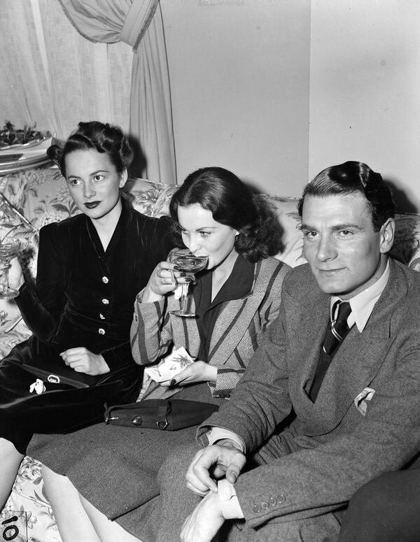 From left to right, Olivia De Havilland, Vivien Leigh, and Vivien’s then-husband Laurence Olivier at a press party at the Georgian Terrace Hotel for the premiere of the movie, "Gone with the Wind" in December 1939.
Courtesy of Kenan Research Center at the Atlanta History Center