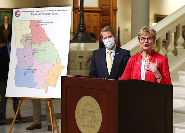 Georgia Public Health Commissioner Dr. Kathleen Toomey speaks, as Gov. Brian Kemp looks on, during an announcement that the state will launch four mass vaccination sites starting Monday. (Curtis Compton / Curtis.Compton@ajc.com)