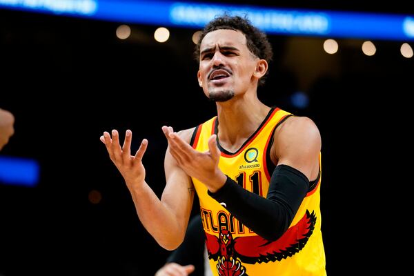 Atlanta Hawks guard Trae Young (11) argues a call in the first half of an NBA basketball game against the Utah Jazz Thursday, Nov. 4, 2021, in Atlanta. (AP Photo/John Bazemore)