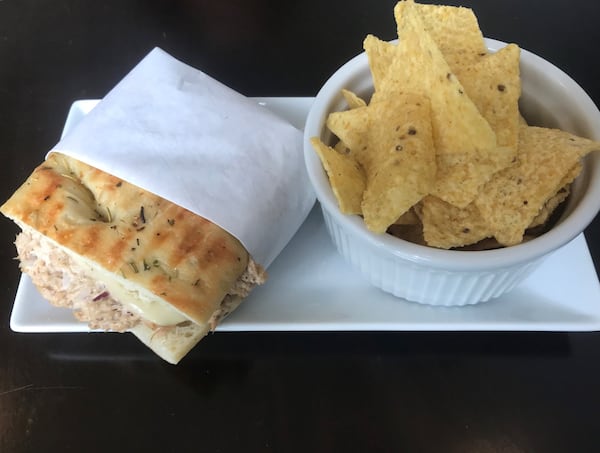 The Tuna Melt Panini features tuna salad made with dolphin-safe, pole- and line-caught tuna with mayonnaise, red onions and melted provolone cheese on rosemary flatbread. LIGAYA FIGUERAS / LFIGUERAS@AJC.COM