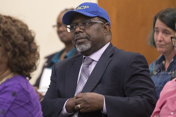 DeKalb County NAACP 1st Vice President Lance Hammonds sits at the Stone Mountain City Council to show his support for the renaming of Venable Street to “Eva Mamie Lane” in Stone Mountain. (Alyssa Pointer/Atlanta Journal Constitution)