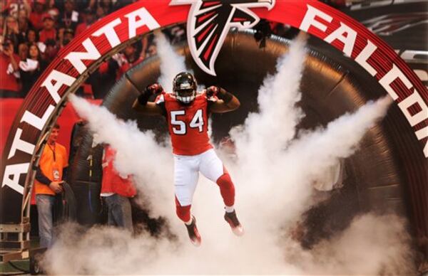 Atlanta Falcons' Stephen Nicholas leaps as he is introduced before the NFL football NFC Championship game against the San Francisco 49ers Sunday, Jan. 20, 2013, in Atlanta. (AP Photo/John Bazemore)