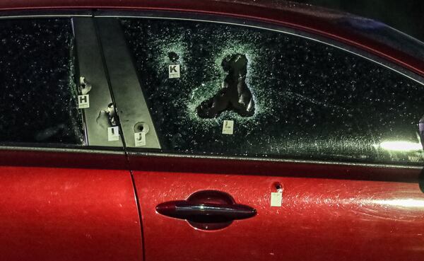 Several bullets shattered the car’s windows and doors.