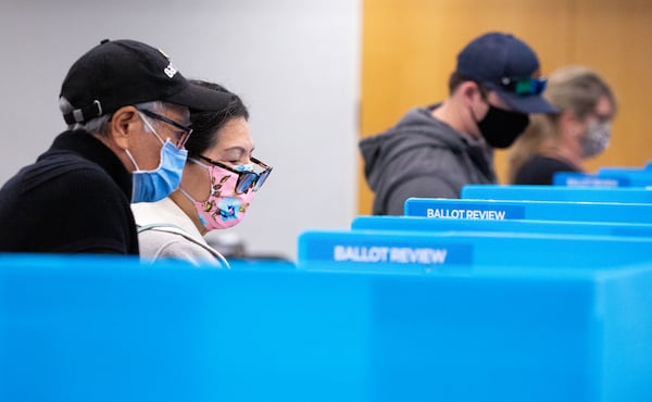 Voters cast their ballots at the Gwinnett County Department of Water Resources in Lawrenceville on Nov. 3. A study found that 49% of Georgia voters who cast ballots that day in the presidential election took time to review their printed ballots to check for errors. (Casey Sykes for The Atlanta-Journal Constitution)