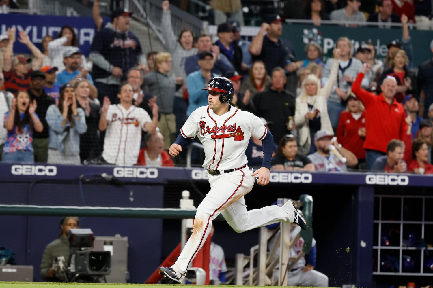 Braves third baseman Austin Riley (27) approaches home plate to score his team's first run during the fourth inning of a baseball game against the New York Mets at Truist Park on Saturday, Oct. 1, 2022. Miguel Martinez / miguel.martinezjimenez@ajc.com