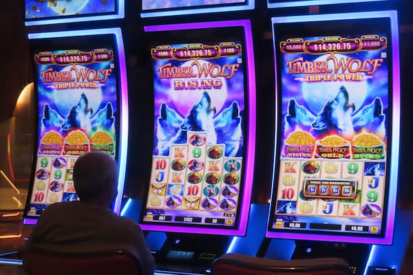 A gambler plays a slot machine at the Hard Rock casino in Atlantic City, N.J., on Oct. 3, 2024, a month in which internet gambling set a new revenue record in New Jersey at $213 million. (AP Photo/Wayne Parry)