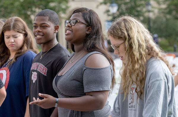 Alex French (L) and his sister Alexis participate in their high school graduation practice at the Georgia Military College Preparatory School in Milledgeville Wednesday, May 24, 2022. (Steve Schaefer / steve.schaefer@ajc.com)