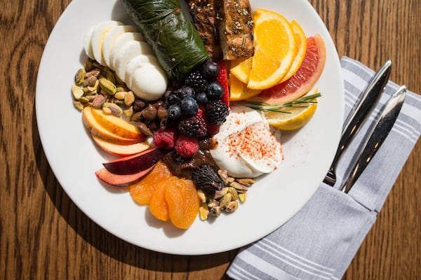  Mediterranea Mediterranean Breakfast with fresh fruit, dried fruit, nuts, dolmas, hard cooked egg, yogurt , fig compote, and seasoned bread. / Photo credit- Mia Yakel.