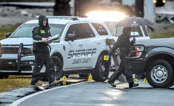 Investigators examine the scene of the fatal high-speed crash.