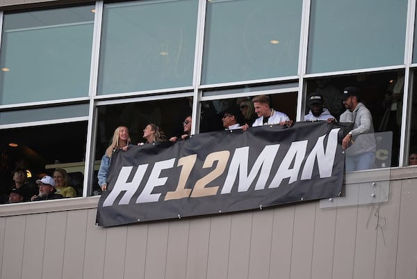 Fans hold a sign in support of the Heisman Trophy campaign for Colorado wide receiver Travis Hunter in the second half of an NCAA college football game against Utah Saturday, Nov. 16, 2024, in Boulder, Colo. (AP Photo/David Zalubowski)