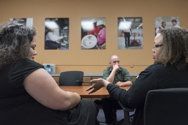 March 30, 2017, Oakwood - Tatrina Young, right, Food Stamp Training and Employment Coordinator, speaks with Jenny Taylor, left, Senior Director of Career Services, during a meeting in Oakwood, Georgia, on Thursday, March 30, 2017. The Goodwill of North Georgia’s career center offers training to many individuals who have a desire to work and are looking for a job in order to continue to receive SNAP benefits. (DAVID BARNES / DAVID.BARNES@AJC.COM)