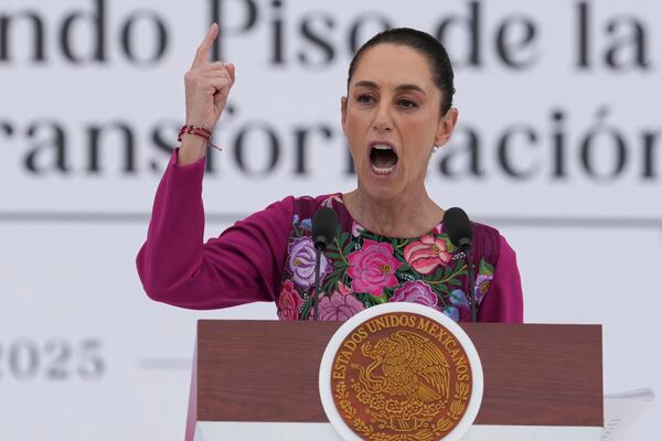 FILE - President Claudia Sheinbaum speaks to the crowd during an event marking her first 100 days in office, at the Zócalo, Mexico City's main square, in Mexico City, Sunday, Jan. 12, 2025. (AP Photo/Fernando Llano, File)