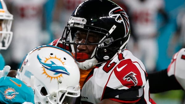 Atlanta Falcons cornerback Damontae Kazee (27) tackles Miami Dolphins wide receiver Jakeem Grant (19), during the first half of an NFL preseason football game, Thursday, Aug. 10, 2017, in Miami Gardens, Fla.