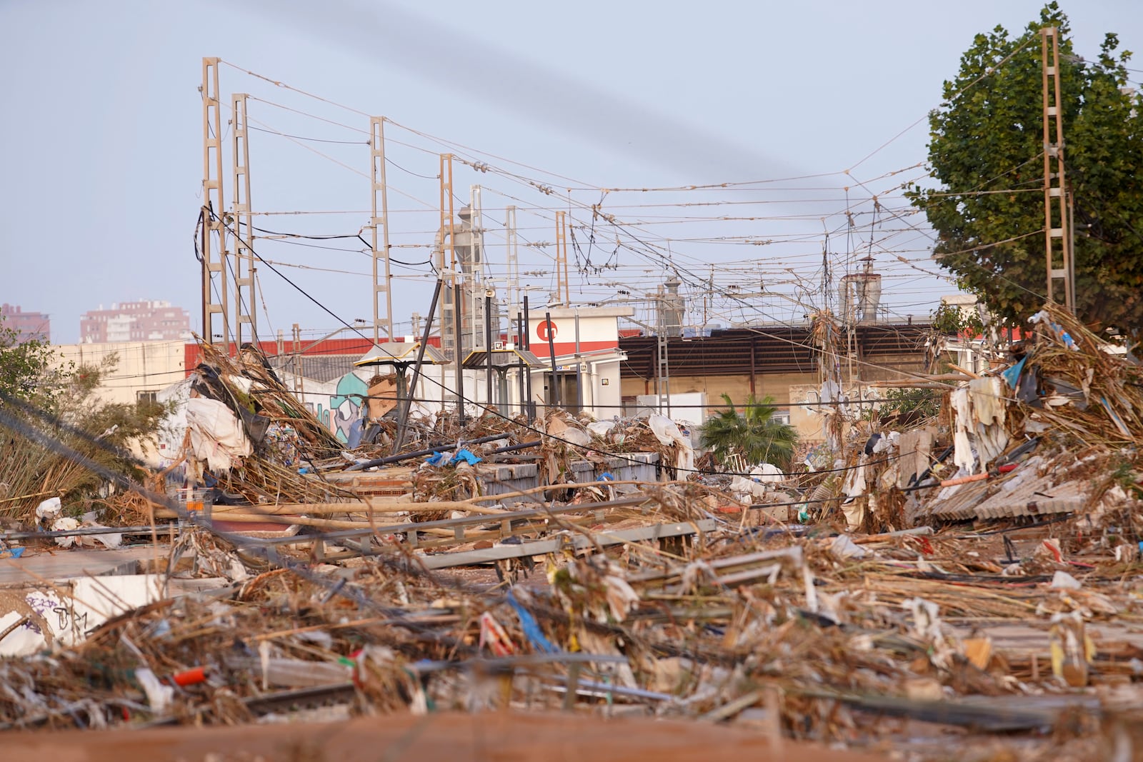 Train tracks are seen covered by branches after floods in Paiporta, near Valencia, Spain, Wednesday, Oct. 30, 2024. (AP Photo/Alberto Saiz)