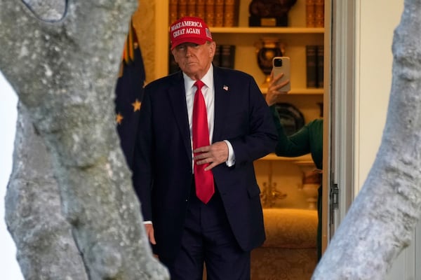 FILE - President Donald Trump walks from the Oval Office to depart on Marine One on the South Lawn of the White House in Washington, Feb. 28, 2025. (AP Photo/Ben Curtis, File)