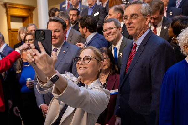 State Rep. Esther Panitch, D-Sandy Springs, takes a selfie before Gov. Brian Kemp signs the antisemitism bill at the Capitol in Atlanta on Jan. 31, 2024. (Arvin Temkar/arvin.temkar@ajc.com)